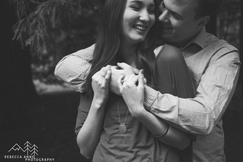 Intimate engagement photo at Lincoln Park in West Seattle